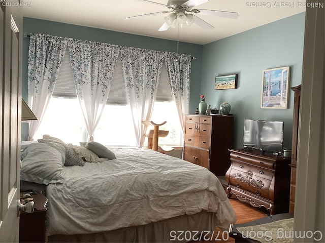 636 Zion Ct S, Howell, MI 48843 - bedroom featuring multiple windows, wood finished floors, and ceiling fan