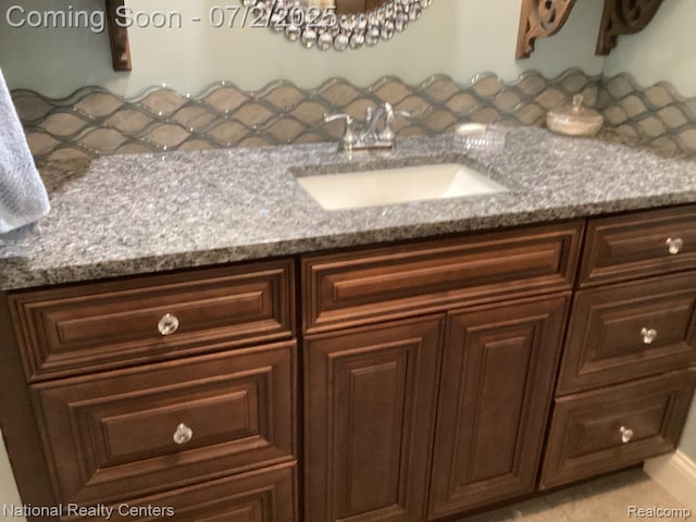 636 Zion Ct S, Howell, MI 48843 - bathroom featuring vanity and backsplash