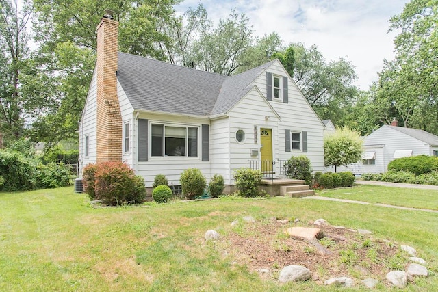 1624 Fulton St, Kalamazoo, MI 49001 - view of front facade featuring a chimney, roof with shingles, and a front lawn