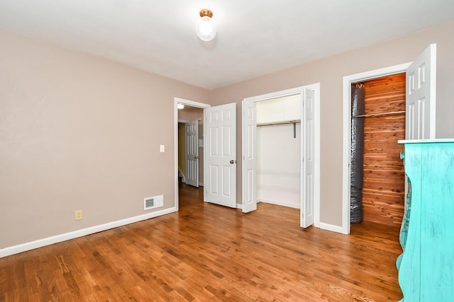 1624 Fulton St, Kalamazoo, MI 49001 - unfurnished bedroom featuring baseboards and wood finished floors