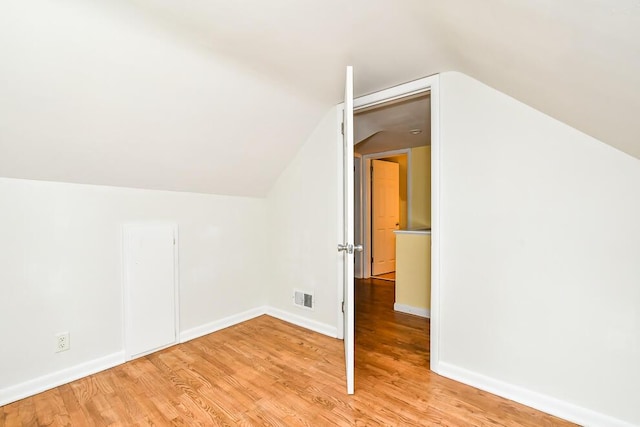 1624 Fulton St, Kalamazoo, MI 49001 - additional living space featuring vaulted ceiling and wood finished floors
