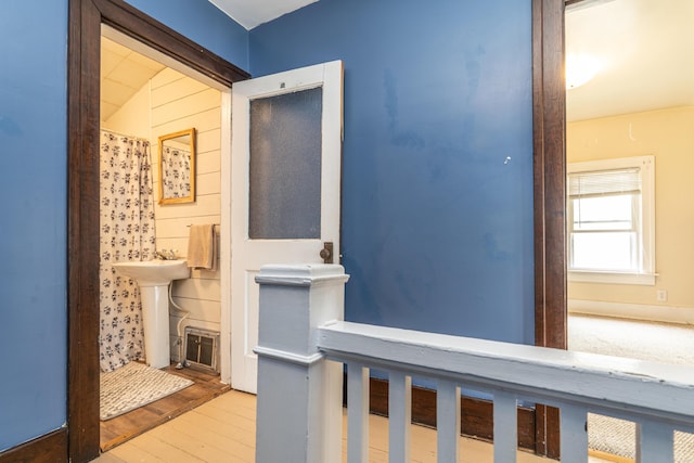 1069 2nd St, Muskegon, MI 49440 - corridor with wood finished floors and a sink