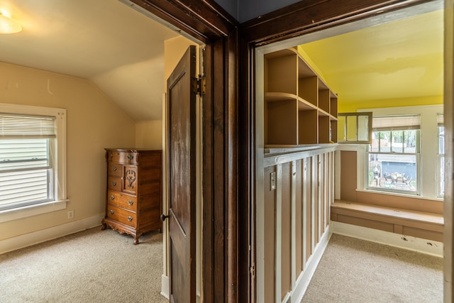 1069 2nd St, Muskegon, MI 49440 - corridor featuring light carpet and lofted ceiling