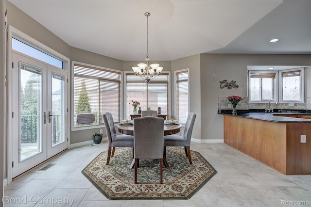 63705 Monticello E, Washington, MI 48095 - dining space featuring a chandelier, french doors, recessed lighting, and light tile patterned flooring