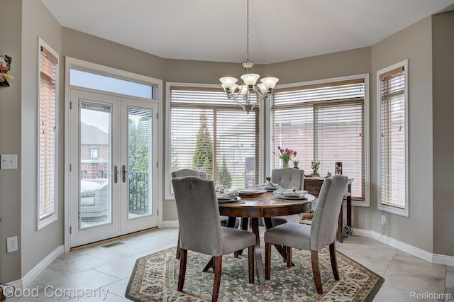 63705 Monticello E, Washington, MI 48095 - dining room featuring a chandelier, plenty of natural light, french doors, and light tile patterned floors