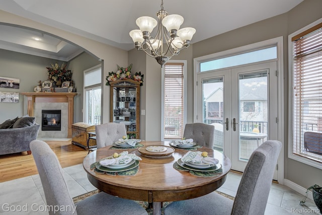 63705 Monticello E, Washington, MI 48095 - dining area featuring plenty of natural light, french doors, and arched walkways