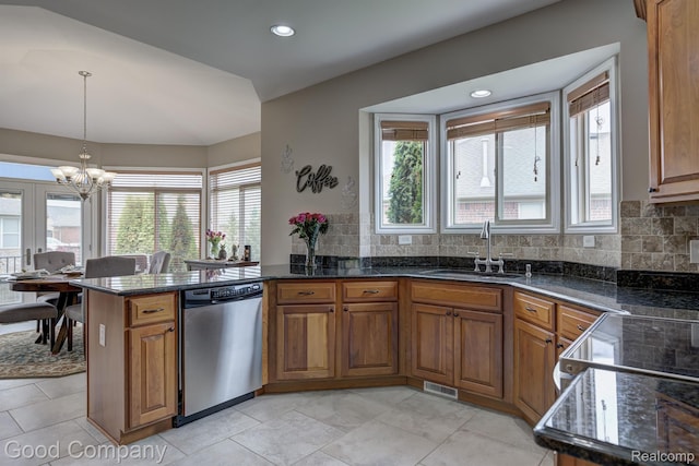 63705 Monticello E, Washington, MI 48095 - kitchen with dishwasher, brown cabinets, a chandelier, backsplash, and recessed lighting
