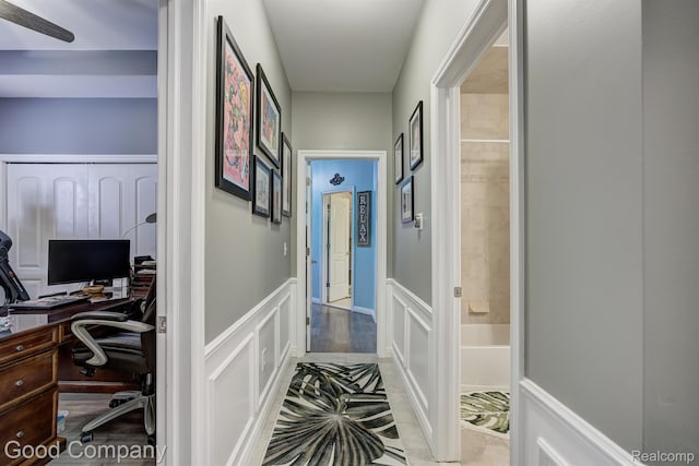 63705 Monticello E, Washington, MI 48095 - hallway with a decorative wall, an office area, and wainscoting