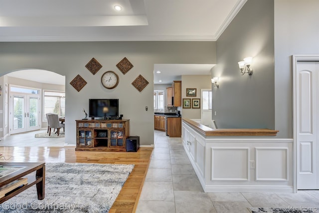 63705 Monticello E, Washington, MI 48095 - living area featuring arched walkways, crown molding, plenty of natural light, light tile patterned floors, and recessed lighting
