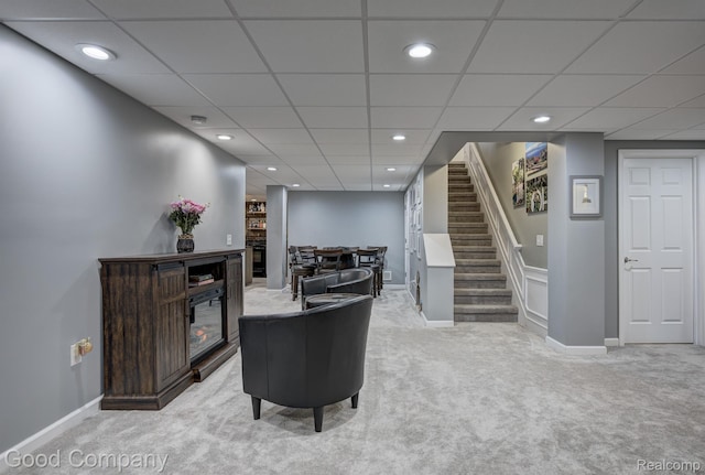 63705 Monticello E, Washington, MI 48095 - living room with light colored carpet, stairway, a paneled ceiling, and recessed lighting