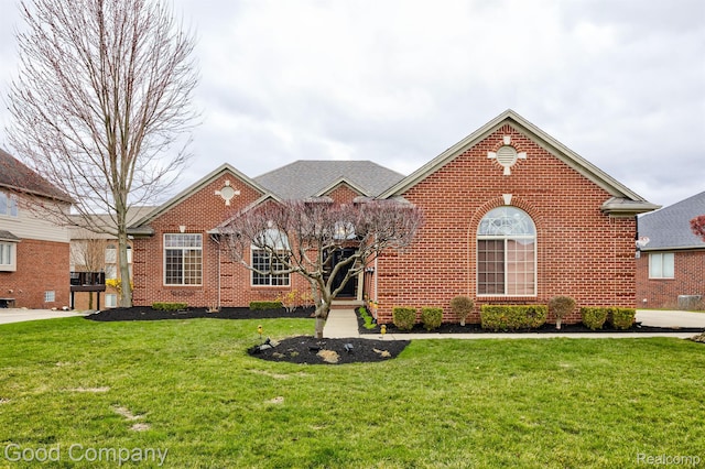 63705 Monticello E, Washington, MI 48095 - view of front of home with brick siding and a front lawn