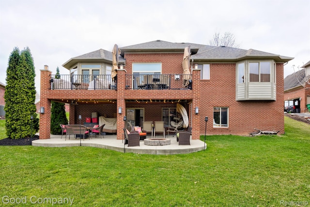 63705 Monticello E, Washington, MI 48095 - rear view of property with a patio area, a fire pit, a yard, a balcony, and brick siding