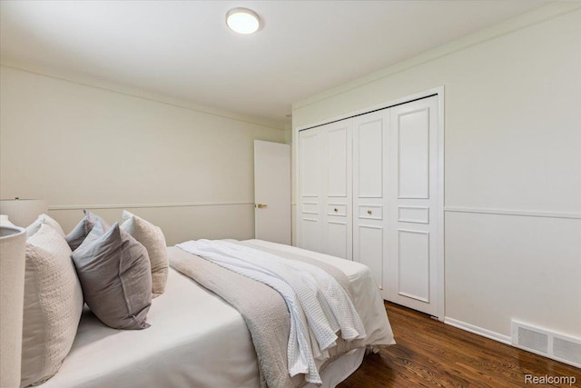 28230 Sutherland Dr, Warren, MI 48088 - bedroom with a closet and dark wood-type flooring