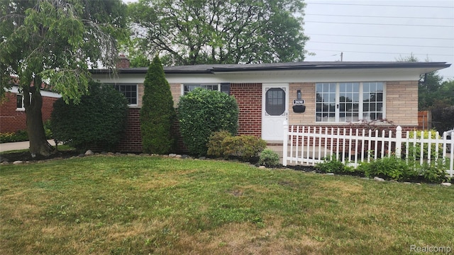 28230 Sutherland Dr, Warren, MI 48088 - view of front of house featuring brick siding and a chimney