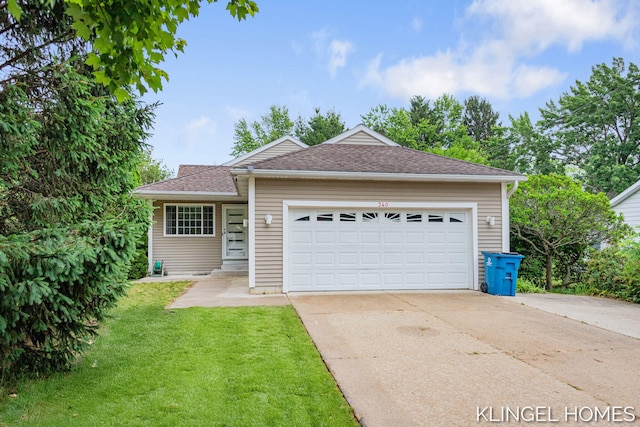 340 S Lake Ave, Spring Lake, MI 49456 - ranch-style house with driveway, a front yard, an attached garage, and roof with shingles