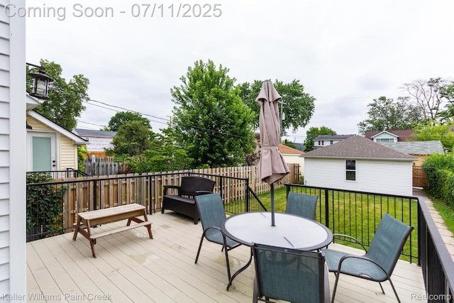 1424 Lakepointe St, Detroit, MI 48230 - deck featuring a fenced backyard, outdoor dining space, and an outdoor structure