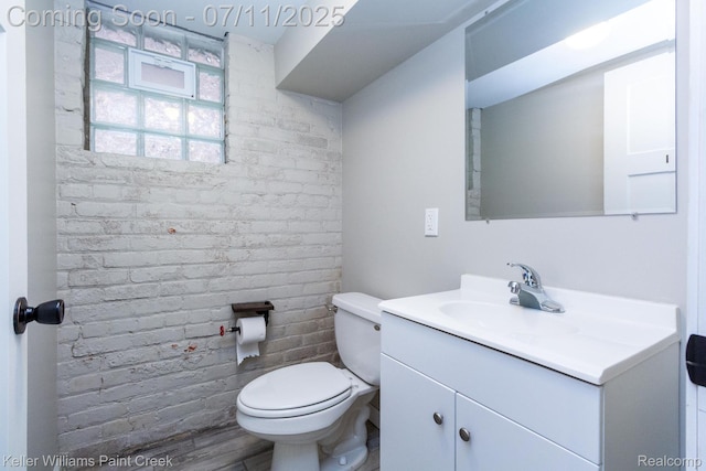 1424 Lakepointe St, Detroit, MI 48230 - bathroom featuring vanity and brick wall
