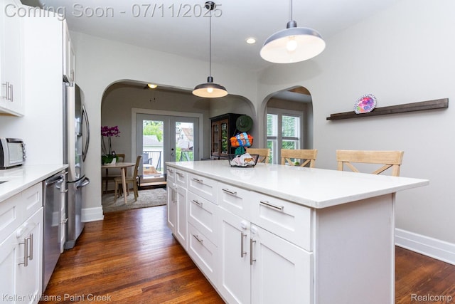 1424 Lakepointe St, Detroit, MI 48230 - kitchen with arched walkways, french doors, appliances with stainless steel finishes, healthy amount of natural light, and recessed lighting