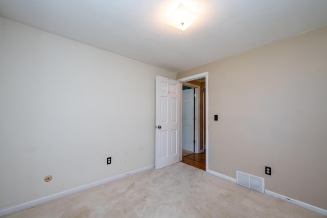 3813 Green Acre Dr, Saint Joseph, MI 49085 - spare room featuring carpet floors and baseboards