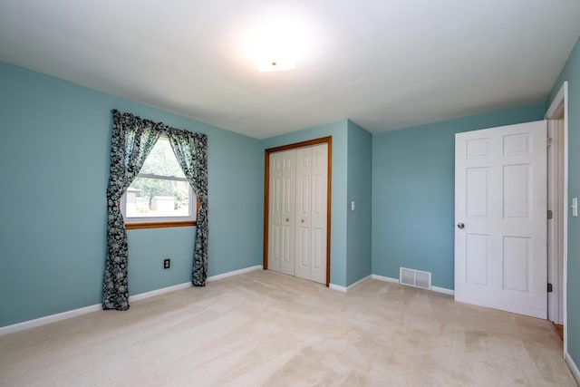 3813 Green Acre Dr, Saint Joseph, MI 49085 - unfurnished bedroom with a closet and light colored carpet