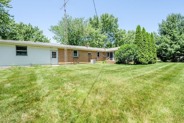 3813 Green Acre Dr, Saint Joseph, MI 49085 - back of property featuring a yard and a chimney