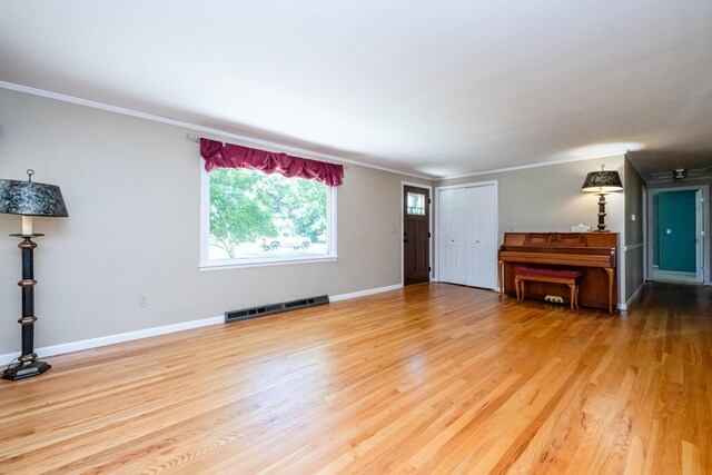 3813 Green Acre Dr, Saint Joseph, MI 49085 - unfurnished living room with ornamental molding and wood finished floors