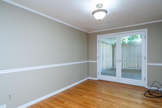 3813 Green Acre Dr, Saint Joseph, MI 49085 - empty room featuring french doors, light wood-type flooring, and ornamental molding