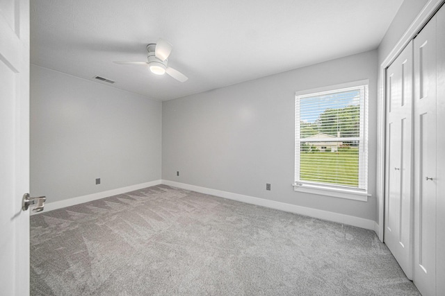 2807 Bartlett Rd, Pleasant Lake, MI 49272 - unfurnished bedroom with carpet flooring, a closet, and ceiling fan