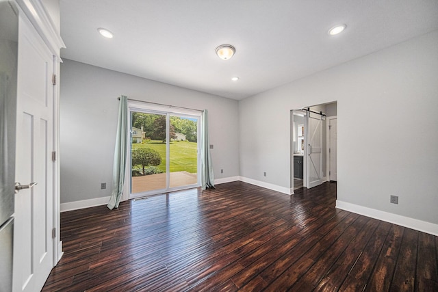 2807 Bartlett Rd, Pleasant Lake, MI 49272 - spare room with wood finished floors, a barn door, and recessed lighting