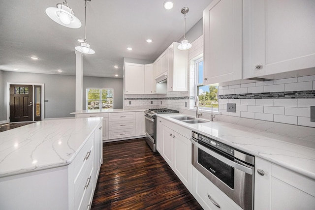 2807 Bartlett Rd, Pleasant Lake, MI 49272 - kitchen with gas range, tasteful backsplash, dark wood-style floors, recessed lighting, and white cabinets