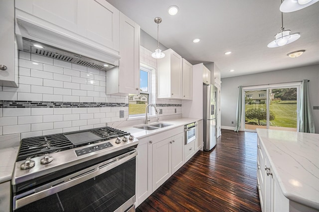 2807 Bartlett Rd, Pleasant Lake, MI 49272 - kitchen featuring stainless steel appliances, dark wood-style flooring, backsplash, pendant lighting, and recessed lighting
