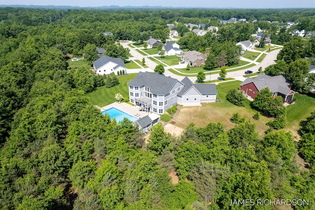 12974 Boulderway Trl, Grand Haven, MI 49417 - aerial view of residential area with a heavily wooded area and a pool area