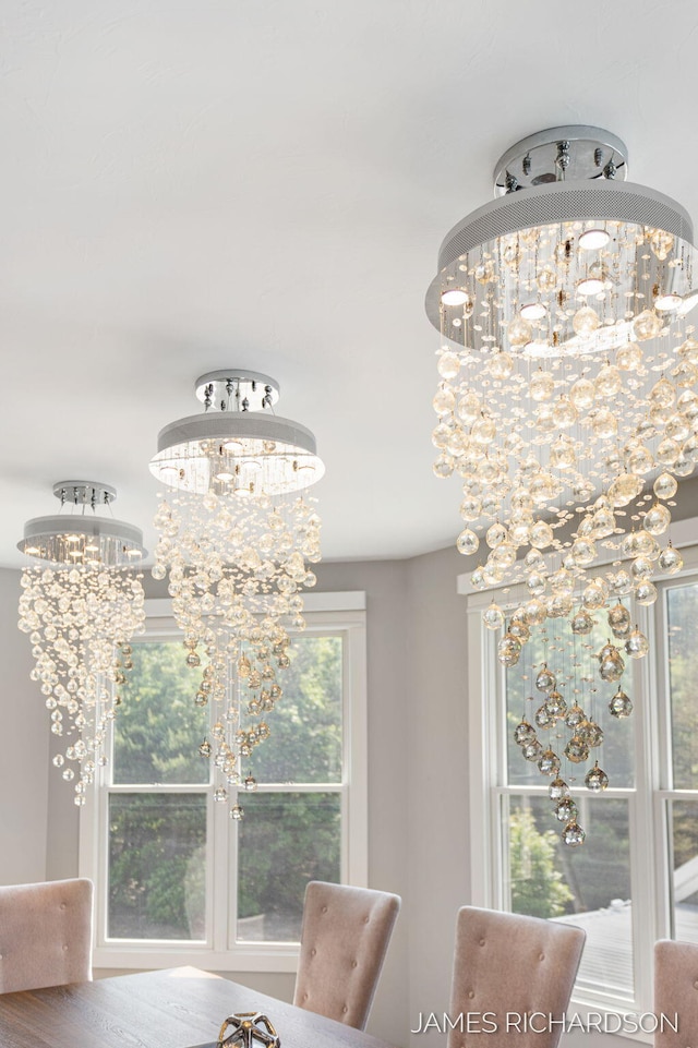 12974 Boulderway Trl, Grand Haven, MI 49417 - dining area with a chandelier