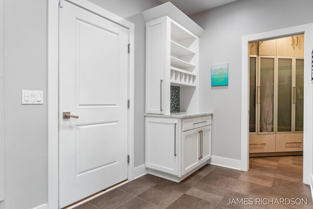 12974 Boulderway Trl, Grand Haven, MI 49417 - mudroom featuring baseboards