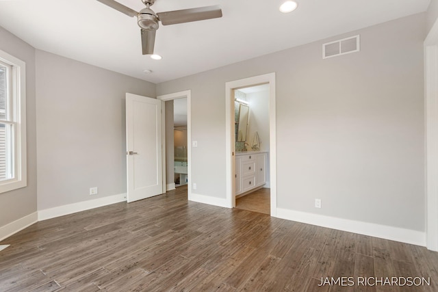 12974 Boulderway Trl, Grand Haven, MI 49417 - unfurnished bedroom with wood finished floors, ensuite bathroom, recessed lighting, and ceiling fan