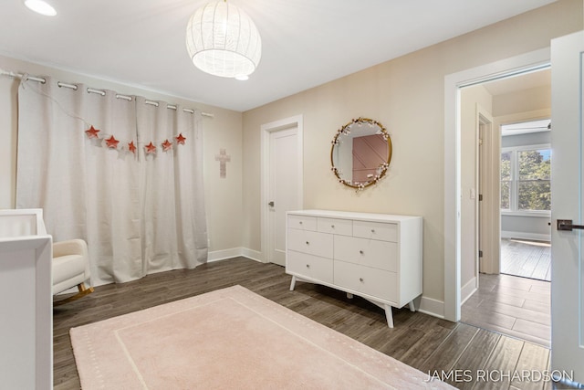 12974 Boulderway Trl, Grand Haven, MI 49417 - bedroom featuring wood finished floors and baseboards