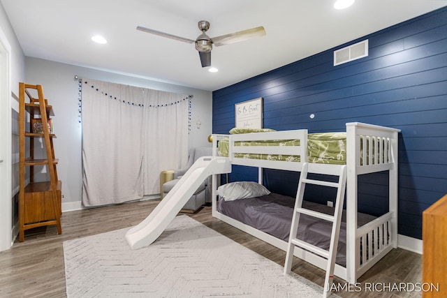 12974 Boulderway Trl, Grand Haven, MI 49417 - bedroom featuring wood finished floors, recessed lighting, and wood walls