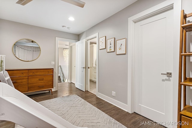 12974 Boulderway Trl, Grand Haven, MI 49417 - bedroom with dark wood finished floors, recessed lighting, and ensuite bath