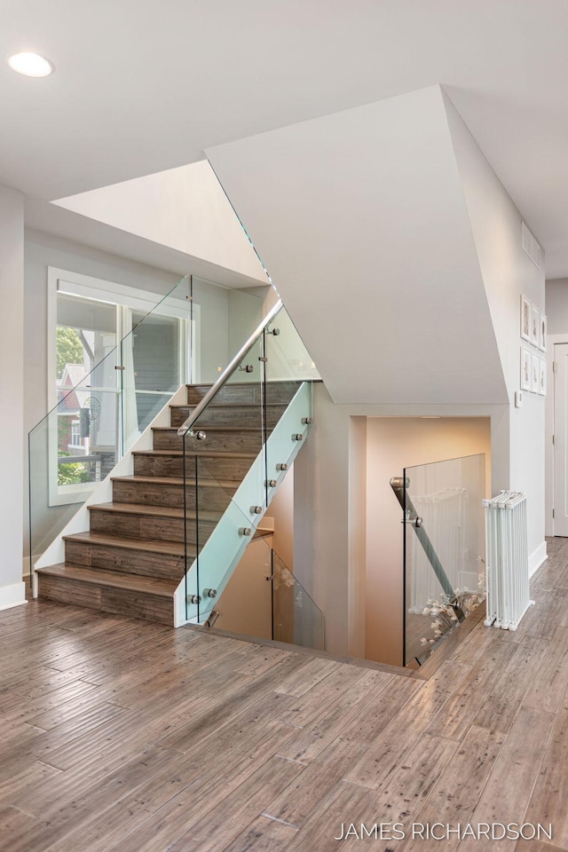 12974 Boulderway Trl, Grand Haven, MI 49417 - stairs featuring wood finished floors and recessed lighting