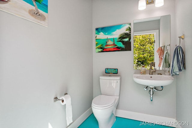12974 Boulderway Trl, Grand Haven, MI 49417 - bathroom with toilet and baseboards