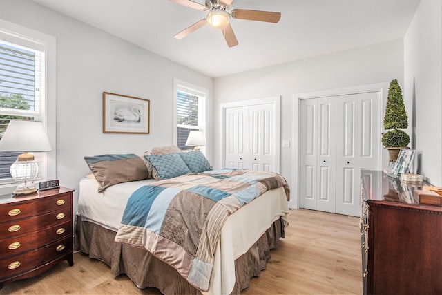 765 S Haven Pl, South Haven, MI 49090 - bedroom featuring two closets, light wood-style flooring, and ceiling fan