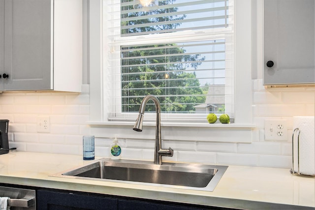 765 S Haven Pl, South Haven, MI 49090 - kitchen with backsplash, light countertops, and healthy amount of natural light