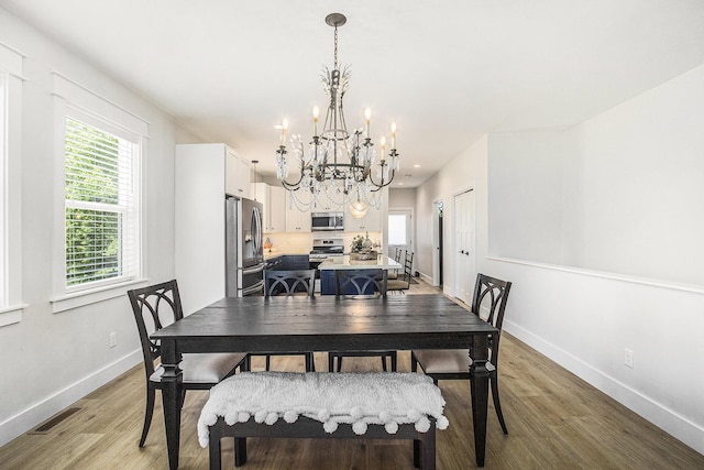 765 S Haven Pl, South Haven, MI 49090 - dining area with a chandelier, light wood-style floors, and recessed lighting