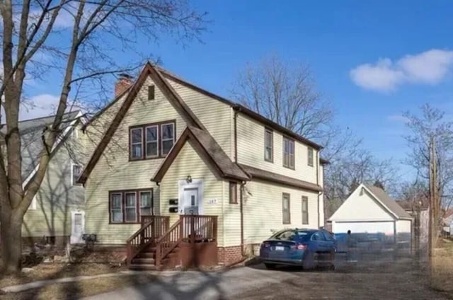 147 Draper Ave, Waterford, MI 48328 - view of front of home featuring a chimney and an outdoor structure