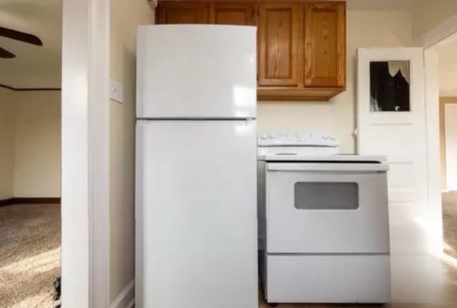 147 Draper Ave, Waterford, MI 48328 - kitchen featuring white appliances, brown cabinetry, ceiling fan, and light countertops