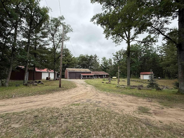 7407 Kermit Ln, South Branch, MI 48761 - view of yard featuring dirt driveway and an outbuilding