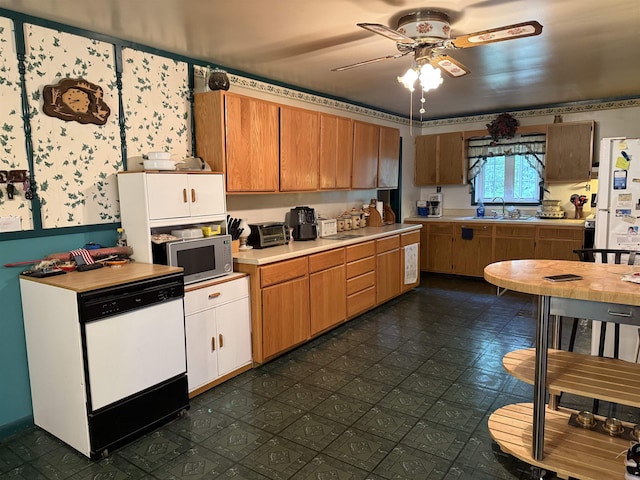 7407 Kermit Ln, South Branch, MI 48761 - kitchen with white appliances, light countertops, and ceiling fan