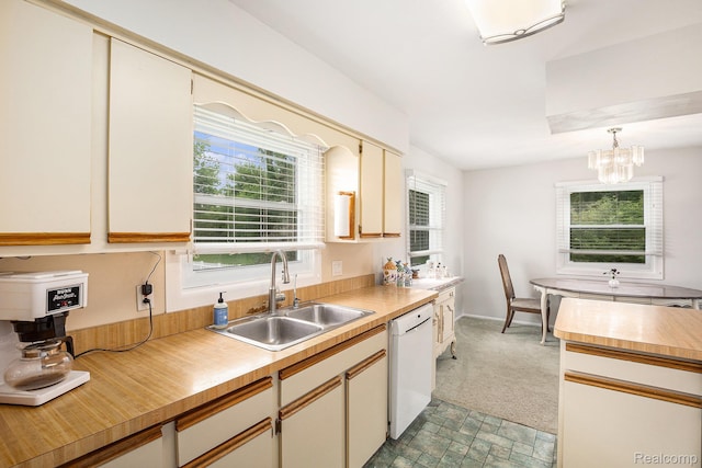 11508 Grand Blanc Rd, Gaines, MI 48436 - kitchen featuring dishwasher, light countertops, healthy amount of natural light, and a chandelier