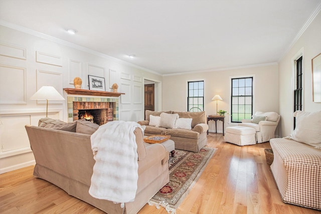 5145 Hensley Dr, Ann Arbor, MI 48103 - living area featuring ornamental molding, a fireplace, and light wood finished floors