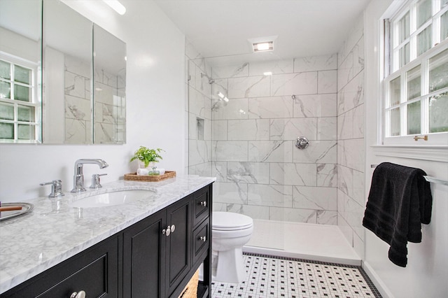 5145 Hensley Dr, Ann Arbor, MI 48103 - bathroom with vanity, healthy amount of natural light, and a tile shower